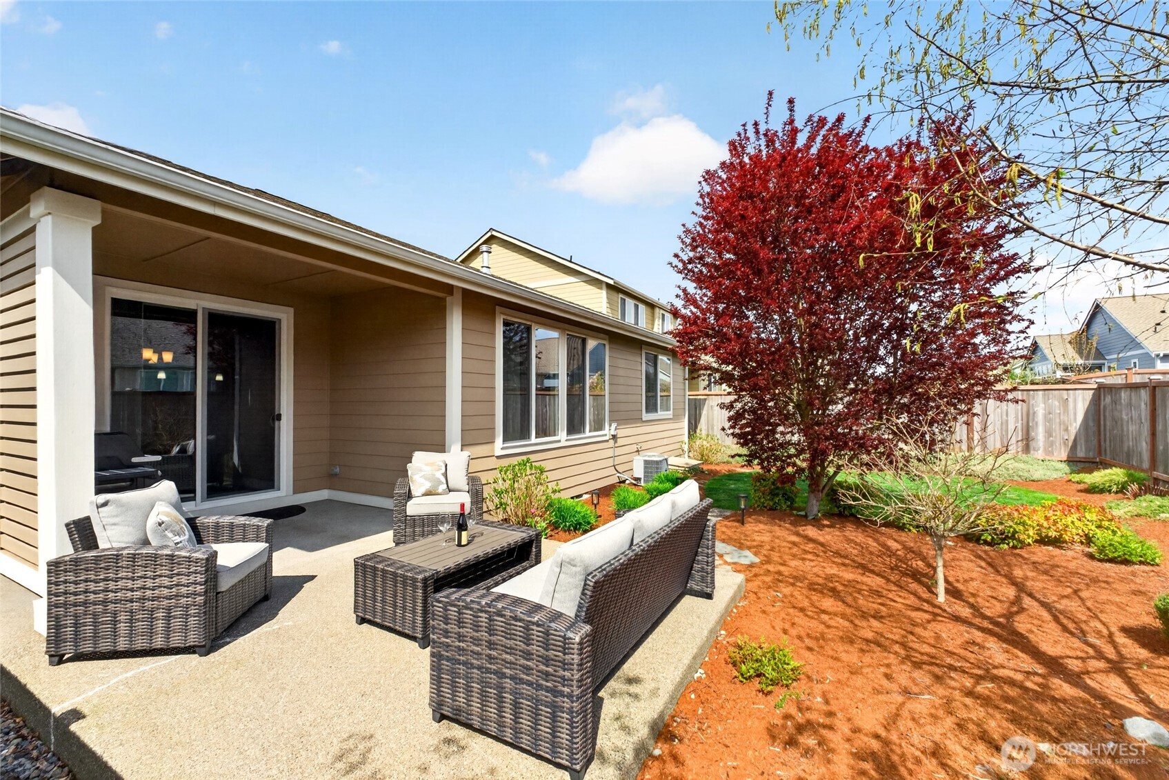 646 Mandee Street Southeast Lacey, WA 98513 - Photo 34 of 39 a view of a patio with couches table and chairs and potted plants