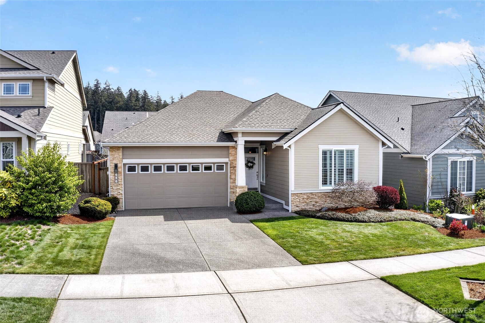 646 Mandee Street Southeast Lacey, WA 98513 - Photo 39 of 39 a front view of a house with a yard and potted plants