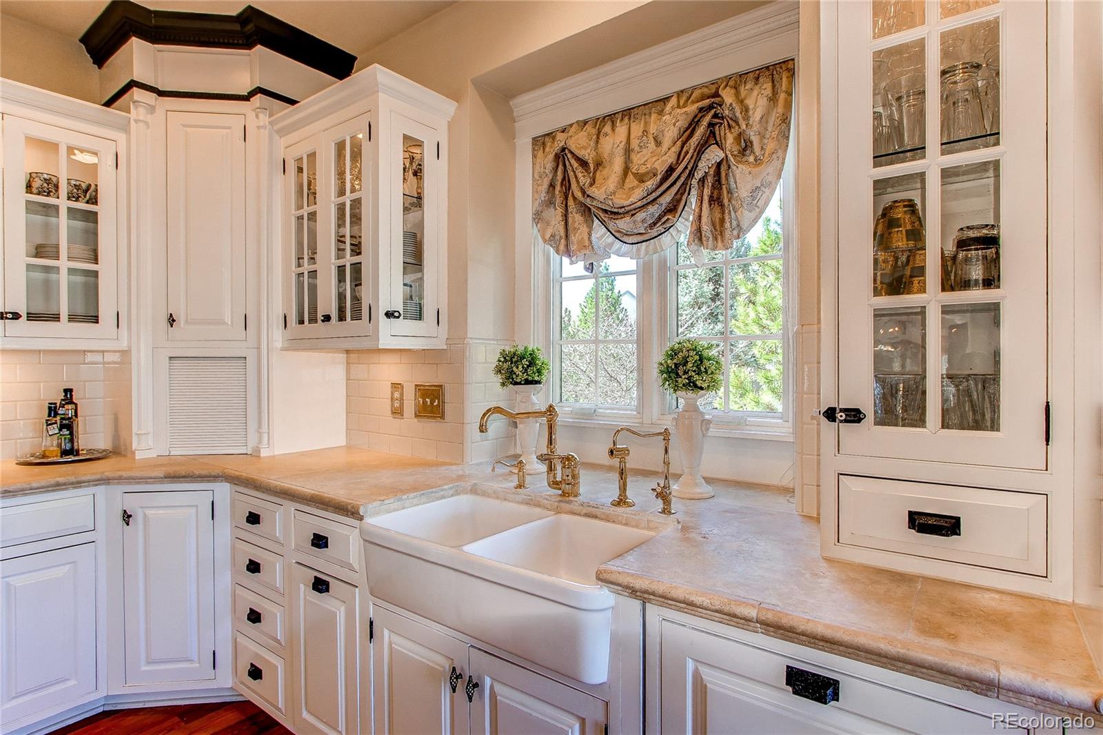 1135 Founders Circle Windsor, CO 80550 - Photo 11 of 45 a kitchen with cabinets and window