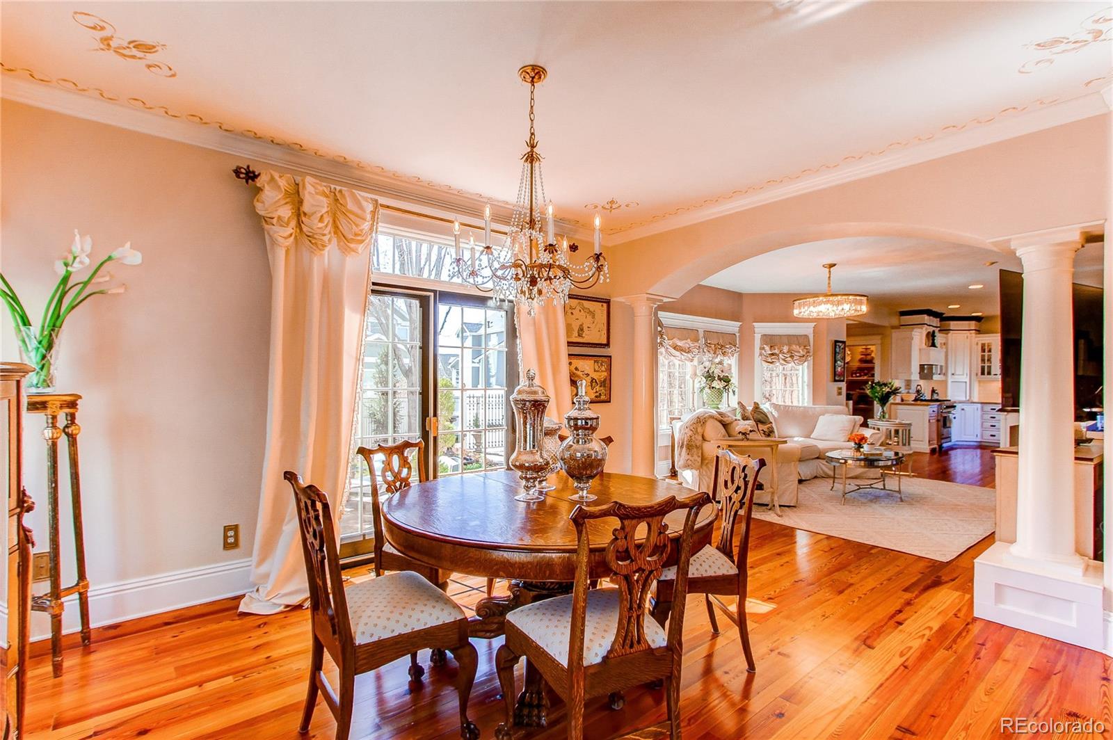 1135 Founders Circle Windsor, CO 80550 - Photo 17 of 45 a view of a dining room with furniture window and wooden floor