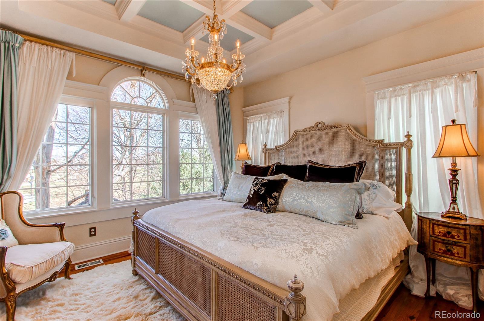 1135 Founders Circle Windsor, CO 80550 - Photo 19 of 45 a bedroom with a bed and wooden floor