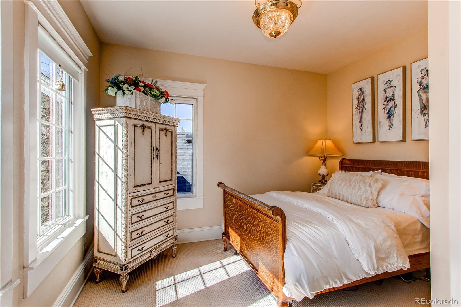 1135 Founders Circle Windsor, CO 80550 - Photo 26 of 45 a bedroom with a bed and a window