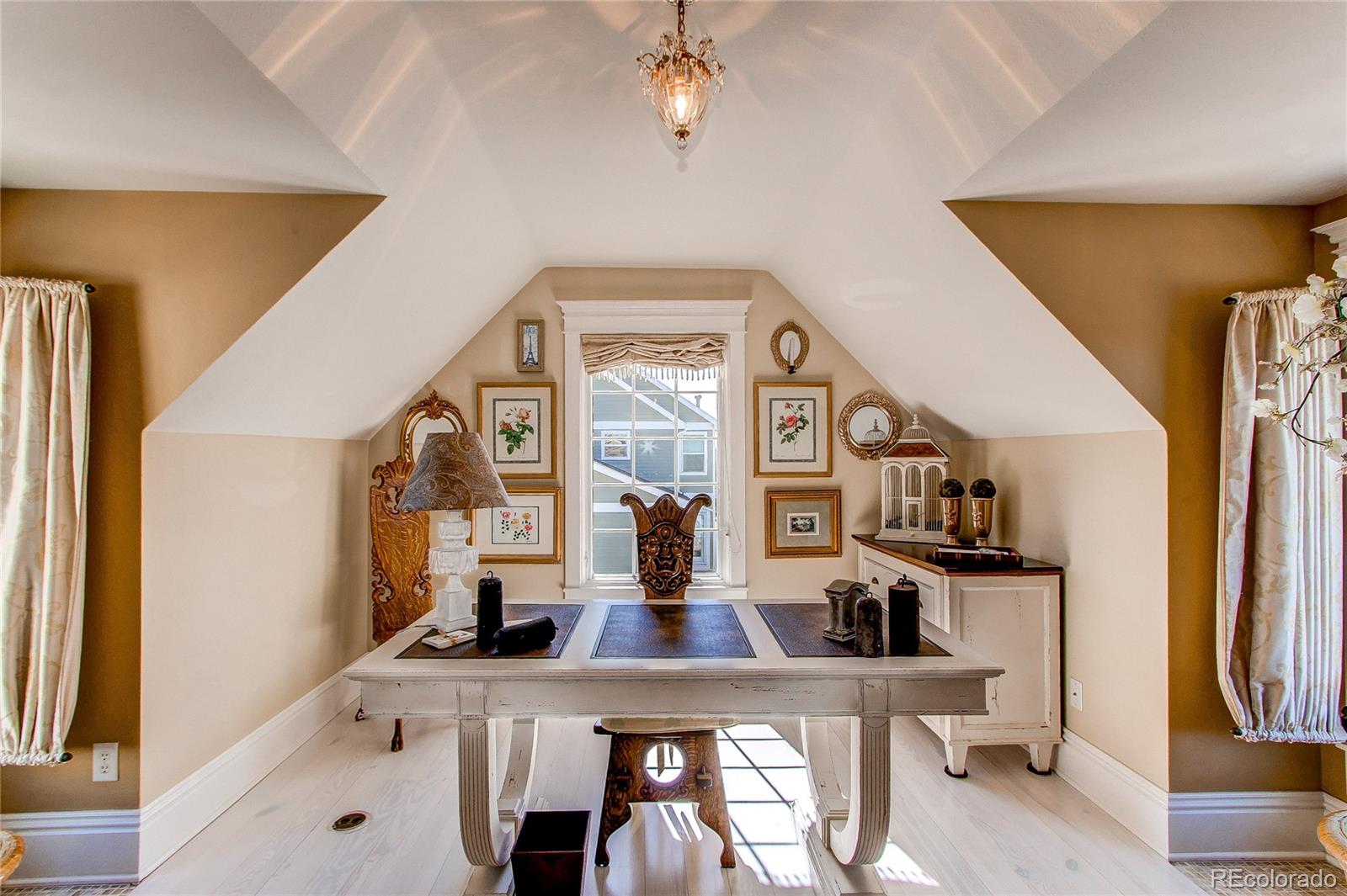 1135 Founders Circle Windsor, CO 80550 - Photo 30 of 45 a view of a living room with furniture and a flat screen tv