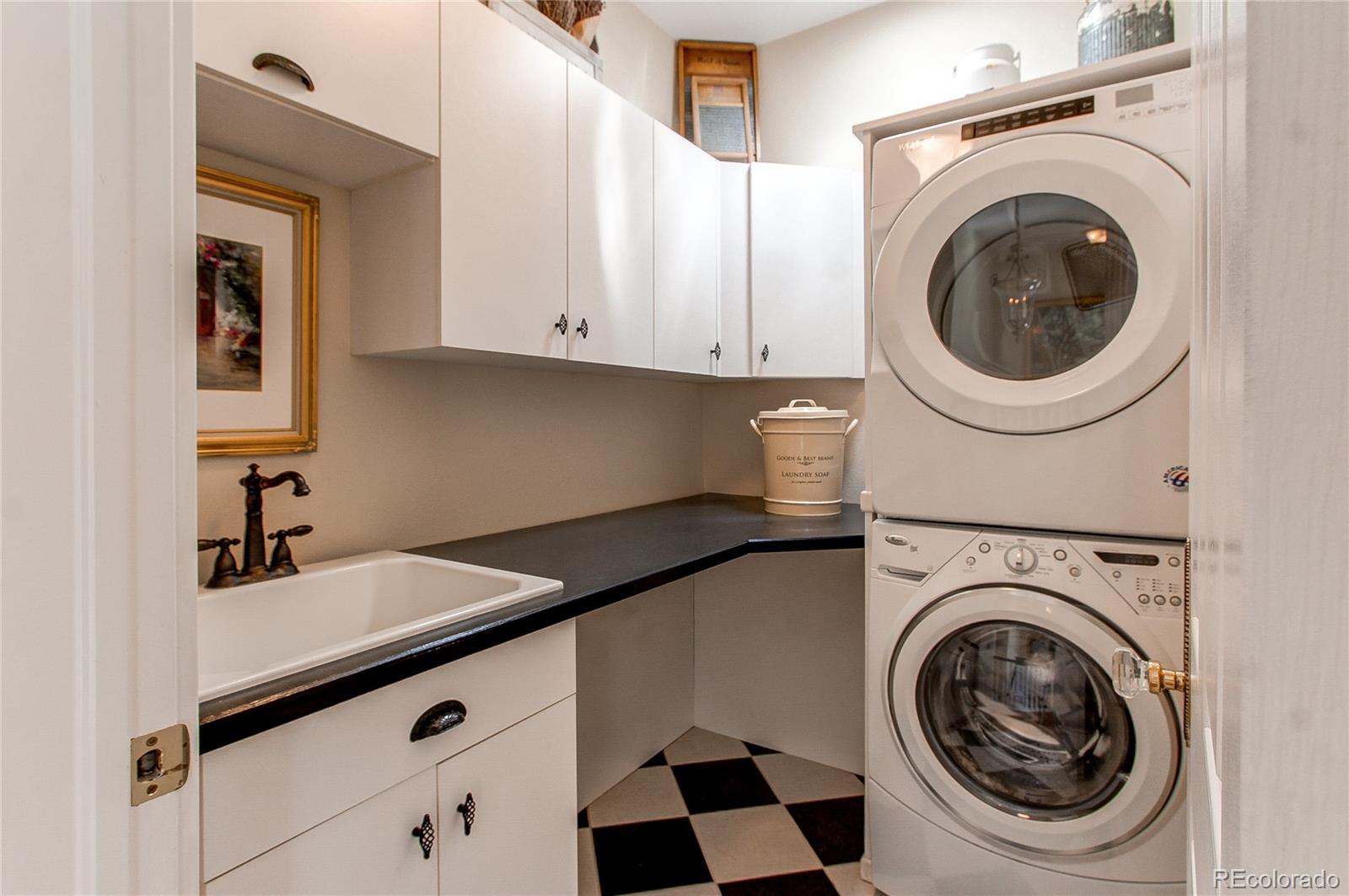 1135 Founders Circle Windsor, CO 80550 - Photo 31 of 45 a utility room with sink dryer and washer