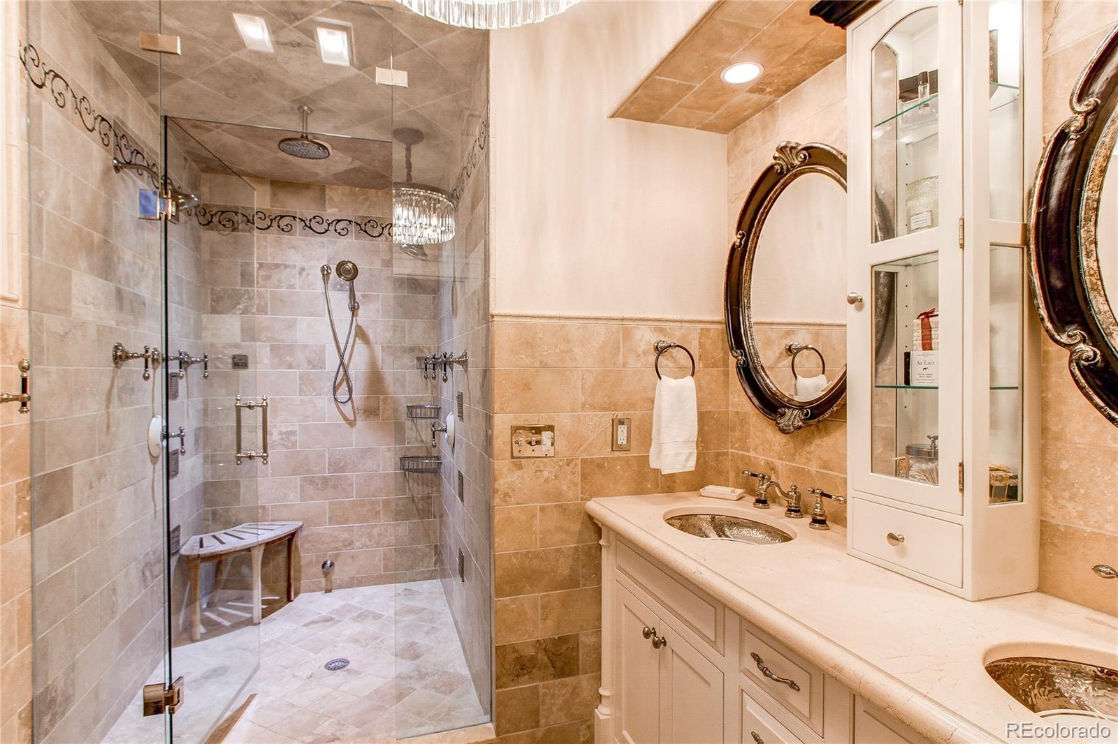 1135 Founders Circle Windsor, CO 80550 - Photo 36 of 45 a bathroom with a sink and a mirror