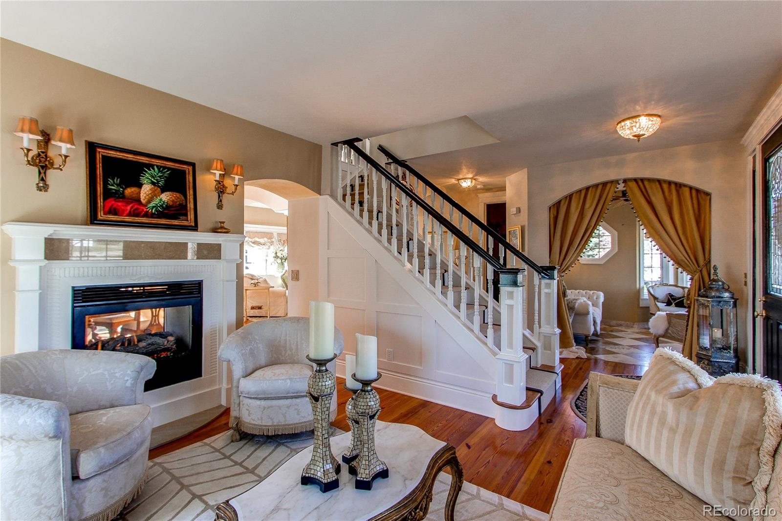 1135 Founders Circle Windsor, CO 80550 - Photo 6 of 45 a living room with furniture and a fireplace