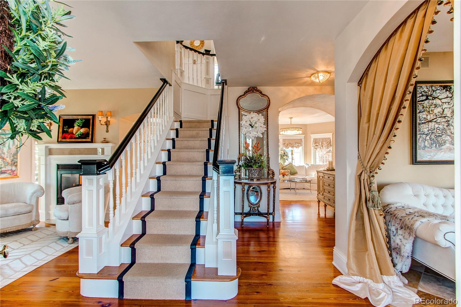 1135 Founders Circle Windsor, CO 80550 - Photo 7 of 45 a view of entryway and hall with wooden floor