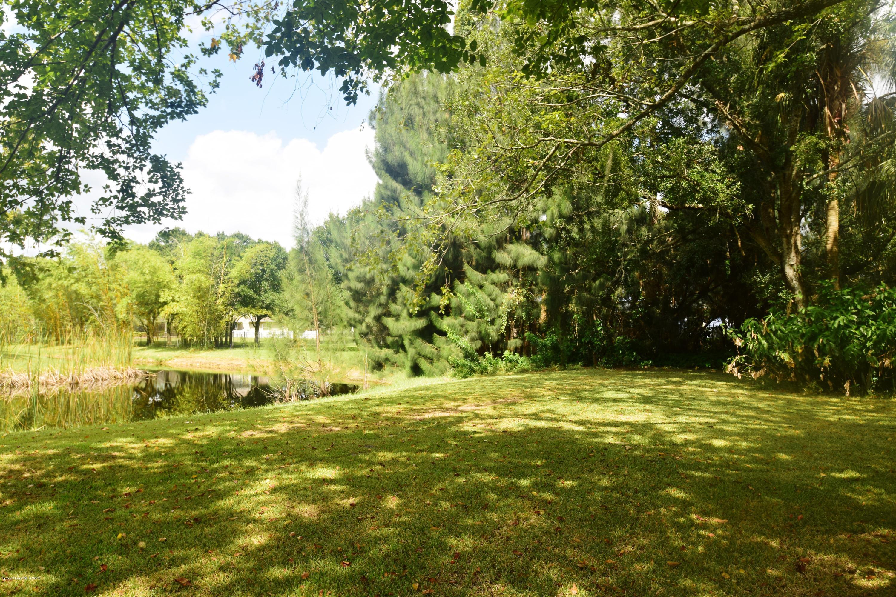 3940 Lake Washington Road Melbourne, FL 32934 - Photo 13 of 32 Backyard Pond Area