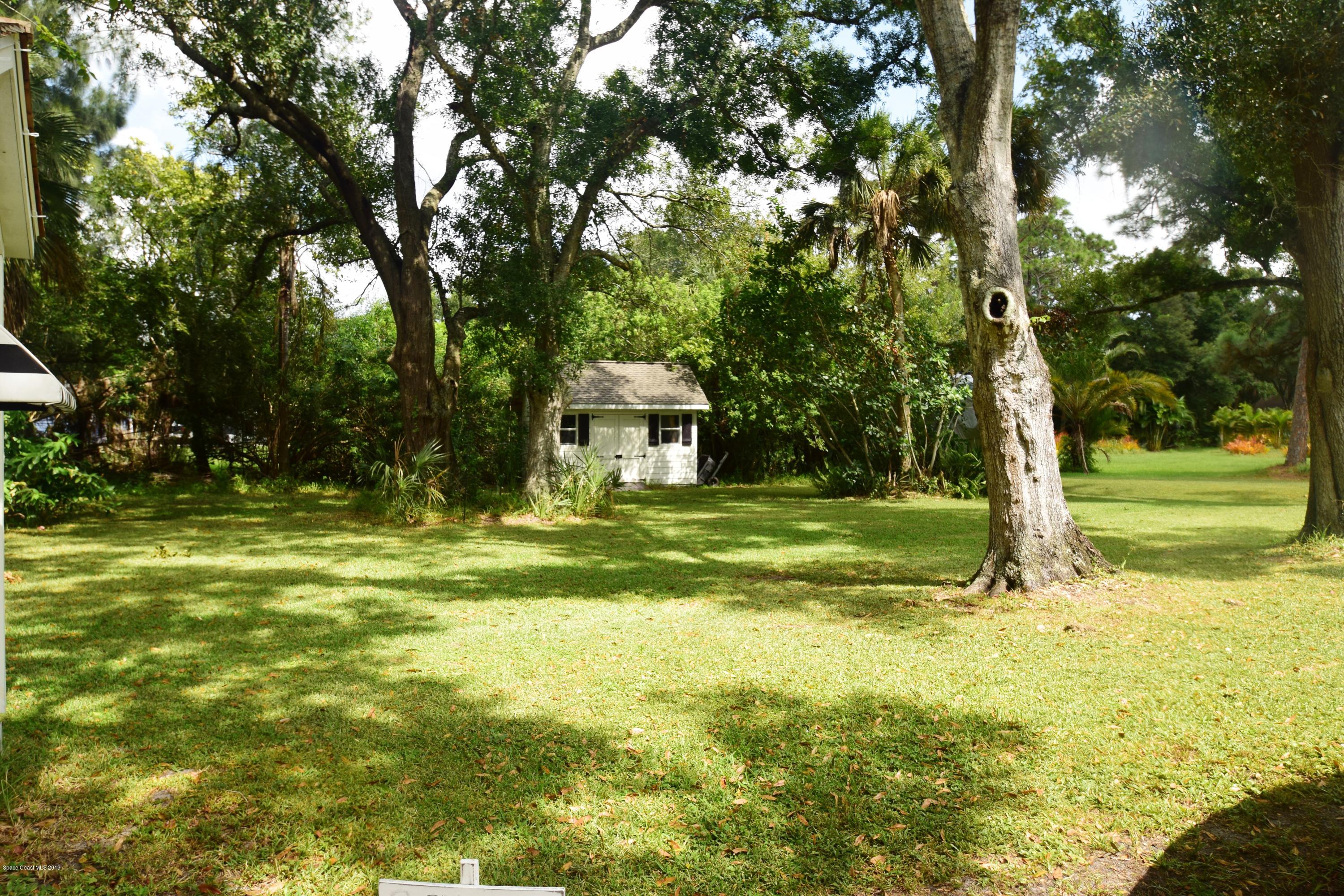 3940 Lake Washington Road Melbourne, FL 32934 - Photo 14 of 32 Backyard with Shed