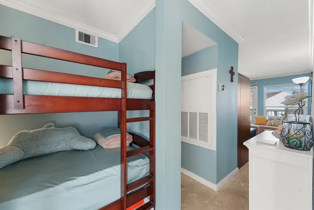 a porch with a table and chairs