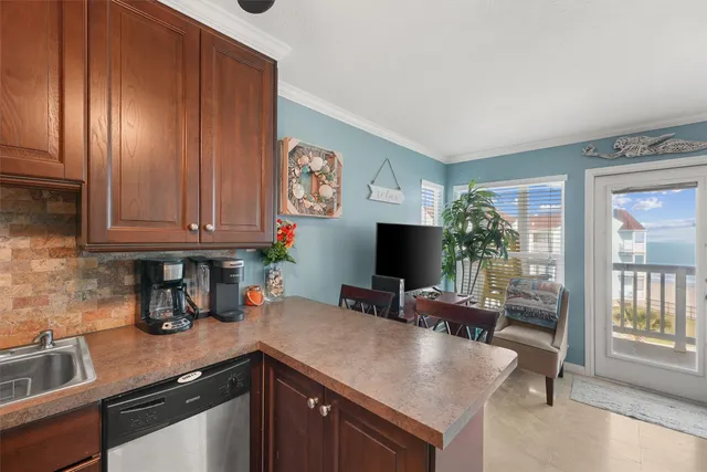a kitchen with stainless steel appliances granite countertop a refrigerator and a stove