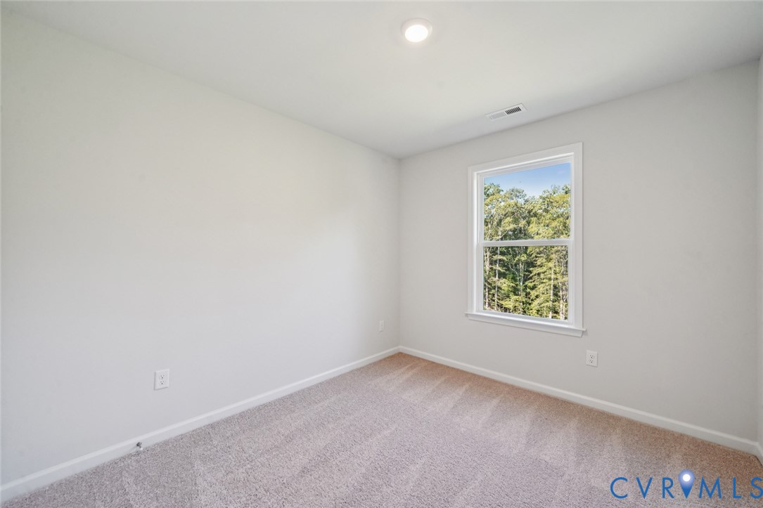 346 Mt Mccauley Way Aylett, VA 23009 - Photo 11 of 32 an empty room with a window