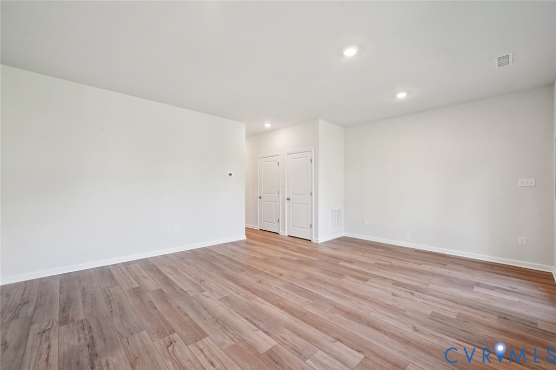 346 Mt Mccauley Way Aylett, VA 23009 - Photo 18 of 32 a view of an empty room with wooden floor