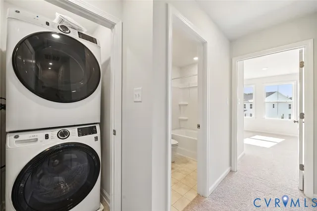 a view of a hallway with washer and dryer