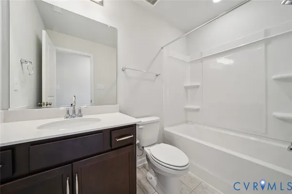 a bathroom with a sink a toilet and a bathtub