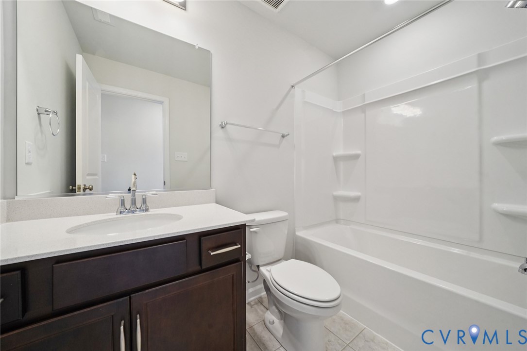 346 Mt Mccauley Way Aylett, VA 23009 - Photo 21 of 32 a bathroom with a sink a toilet and a bathtub