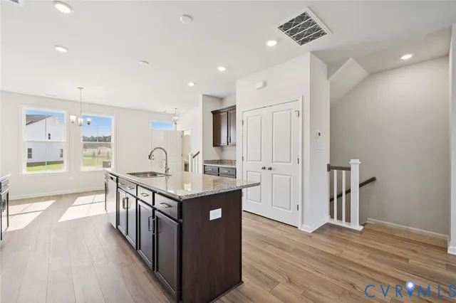 a kitchen with sink and cabinets