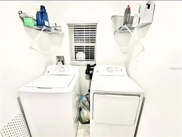 a utility room with dryer and washer