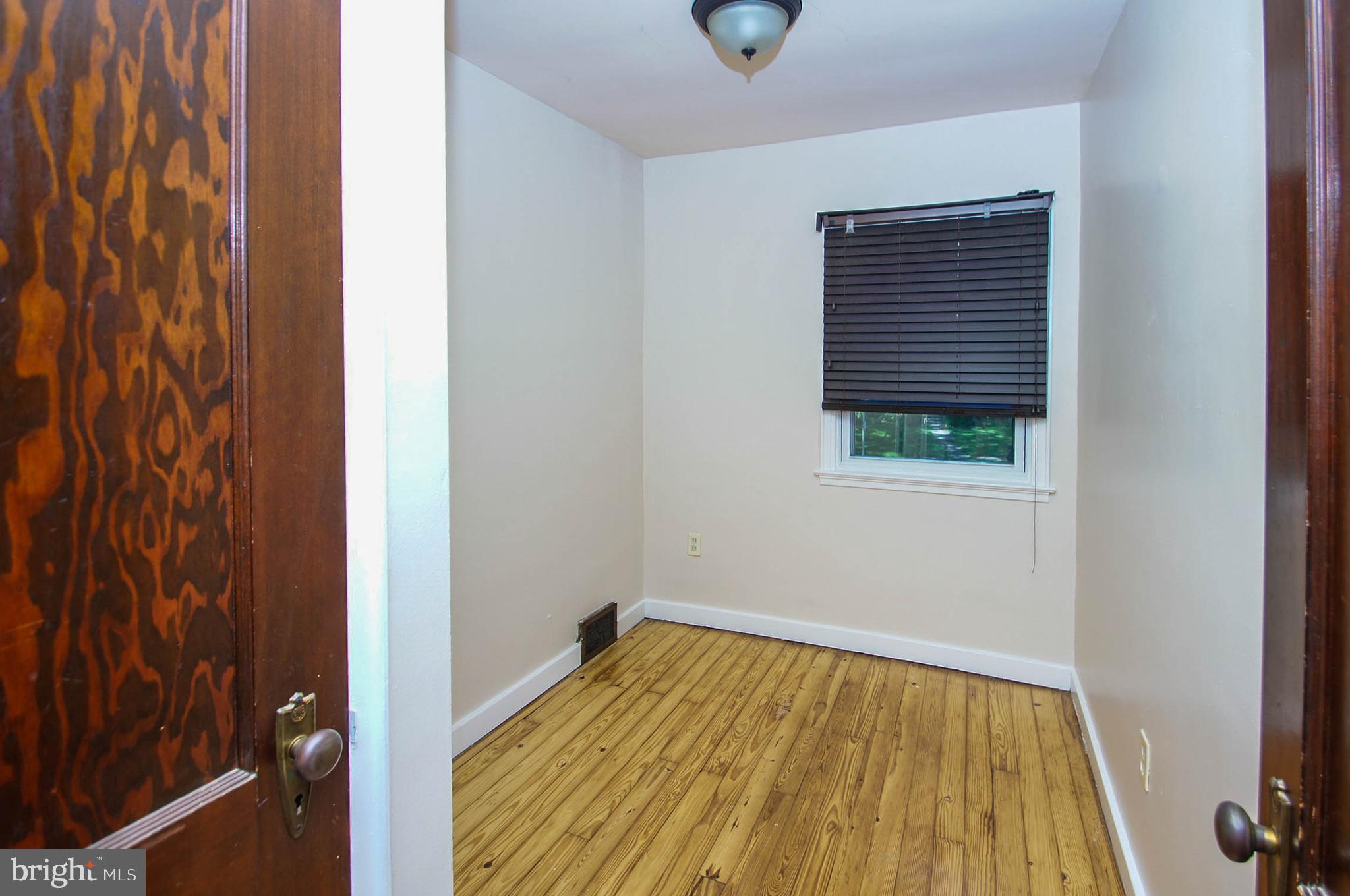 201 Sycamore Road Reading, PA 19611 - Photo 12 of 13 a view of empty room with wooden floor and fan