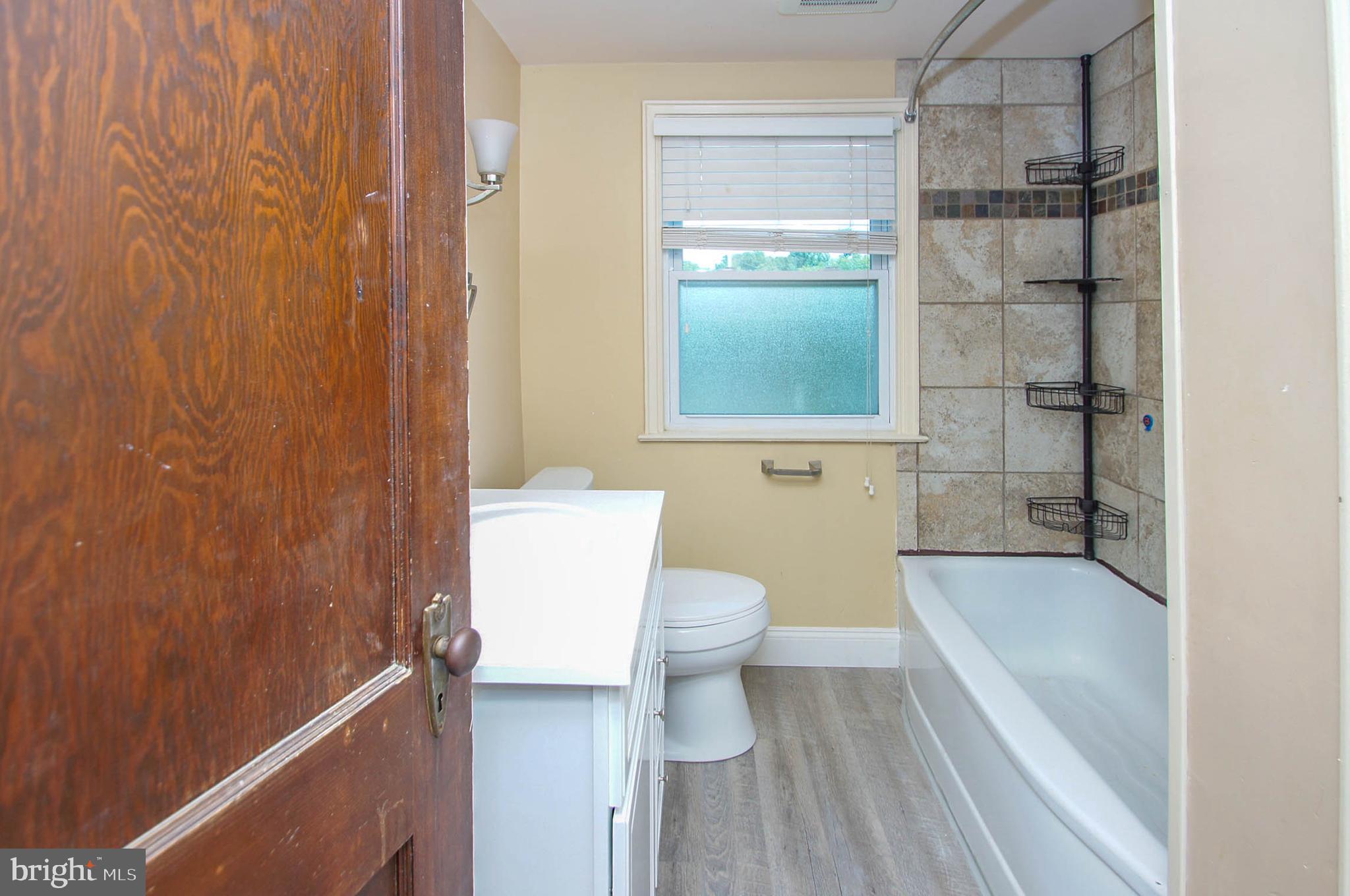201 Sycamore Road Reading, PA 19611 - Photo 13 of 13 a bathroom with a sink a toilet and shower
