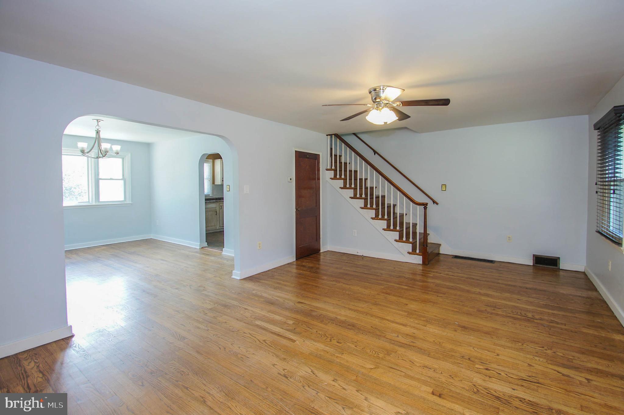 201 Sycamore Road Reading, PA 19611 - Photo 2 of 13 a view of an empty room with window and wooden floor