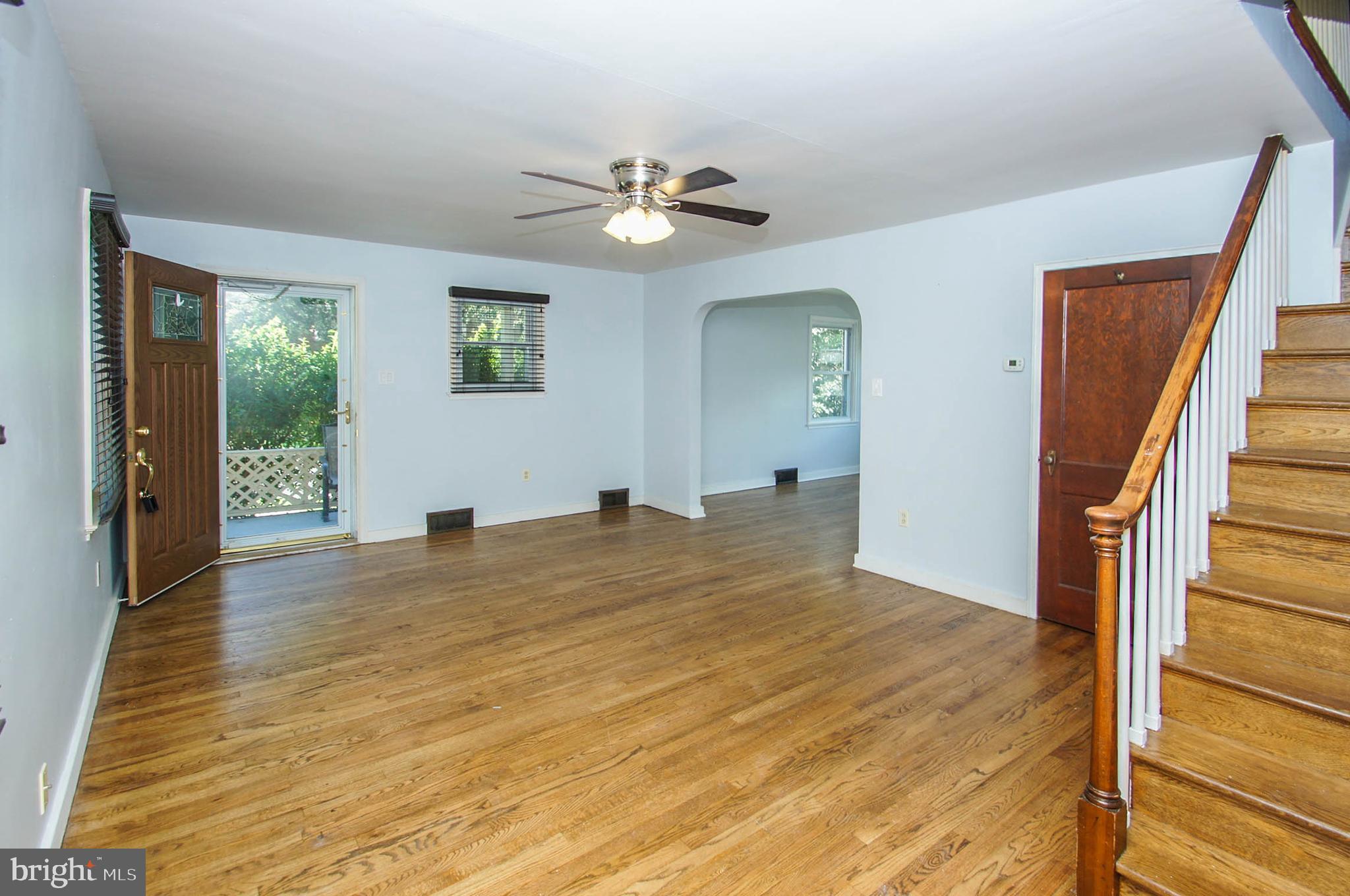 201 Sycamore Road Reading, PA 19611 - Photo 3 of 13 a view of empty room with wooden floor and fan
