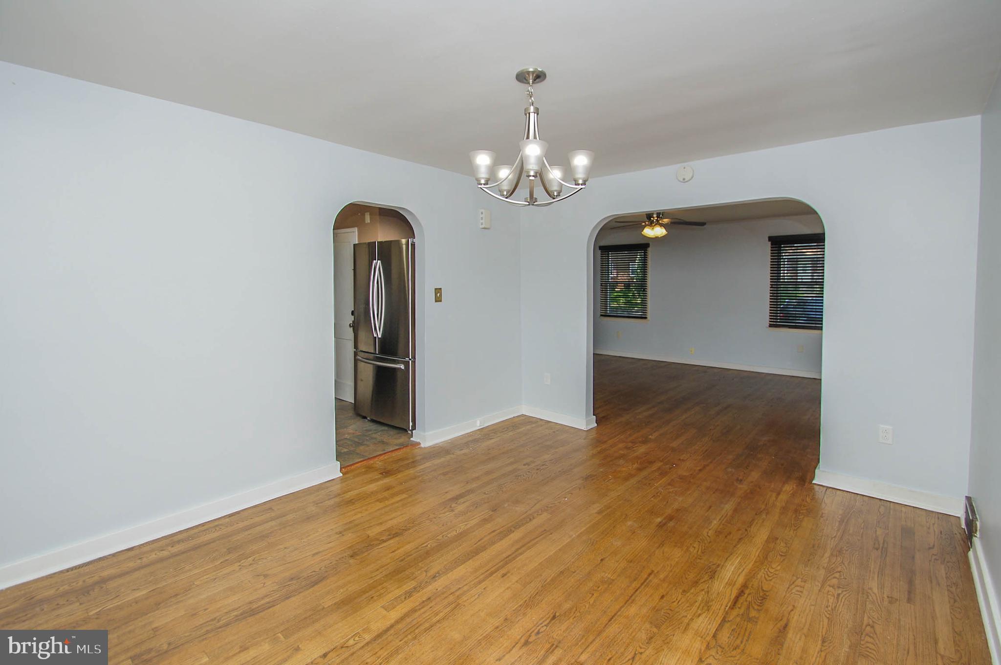 201 Sycamore Road Reading, PA 19611 - Photo 6 of 13 a view of a room with wooden floor chandelier and entryway