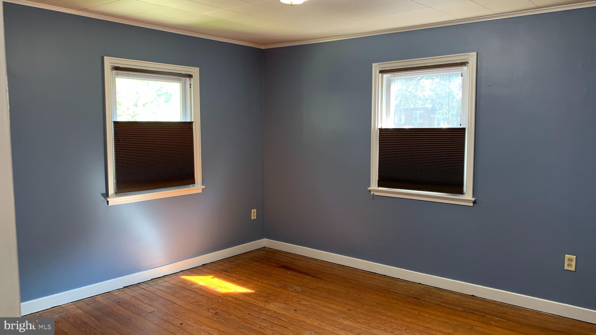 201 Sycamore Road Reading, PA 19611 - Photo 8 of 13 a view of an empty room with wooden floor and a window