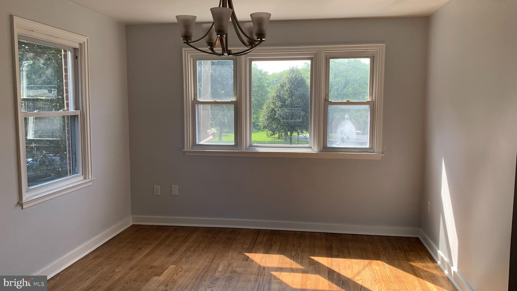 201 Sycamore Road Reading, PA 19611 - Photo 10 of 13 a view of empty room with wooden floor and fan
