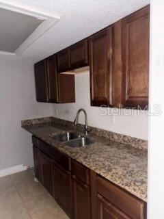 900 Lake Destiny Road, Unit B Altamonte Springs, FL 32714 - Photo 4 of 14 a kitchen with granite countertop stainless steel appliances a sink and a microwave