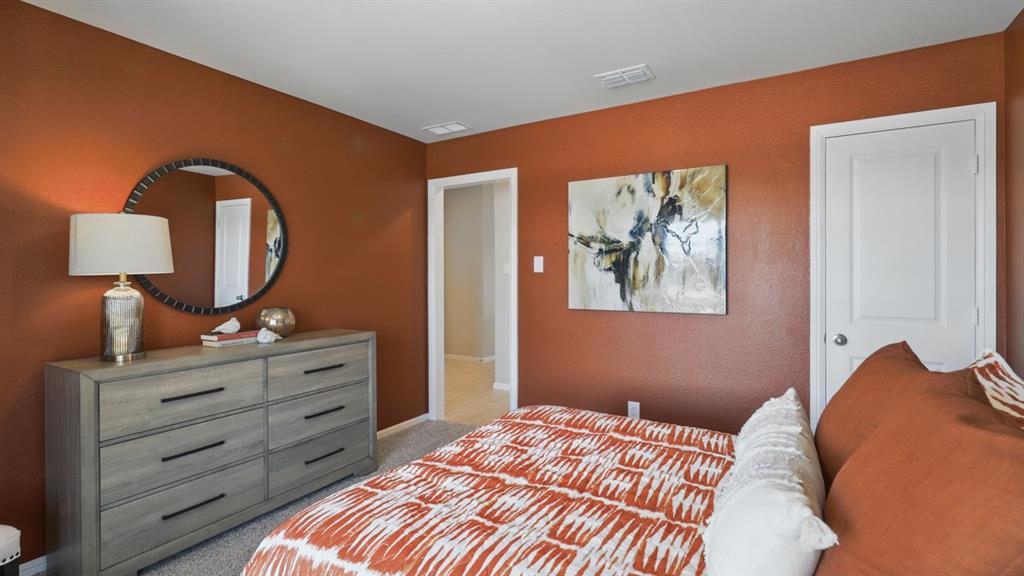336 Pecos Drive Azle, TX 76020 - Photo 25 of 37 a bedroom with a bed and a dresser