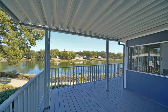 a view of a balcony with wooden floor
