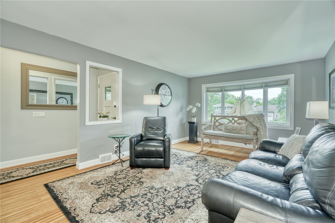 175 Longview Drive Webster, NY 14580 - Photo 6 of 47 Spacious family room with hardwood flooring and la