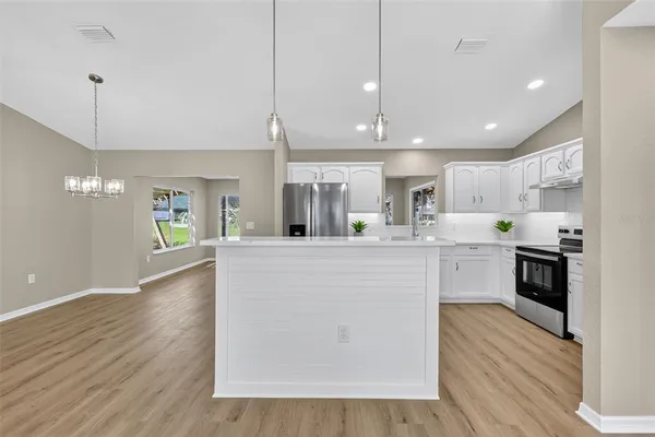 a view of kitchen with cabinets and wooden floor