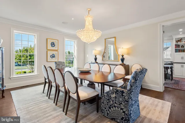 a view of a patio with couches table and chairs and garden