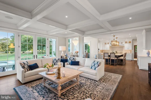 a kitchen with a table chairs stove and cabinets