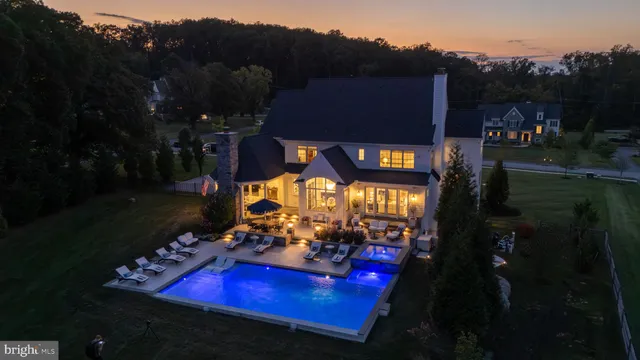 a bathroom with a granite countertop toilet sink and mirror