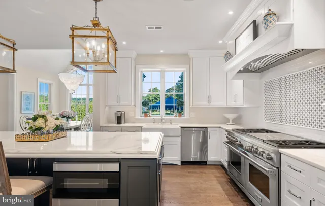 a bathroom with a sink toilet vanity and granite