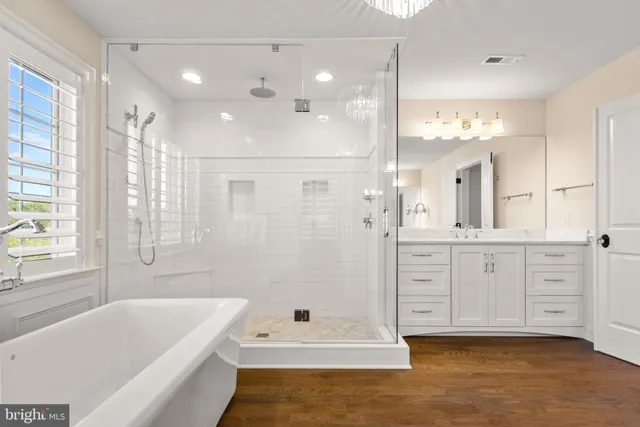 a view of swimming pool with outdoor seating and plants