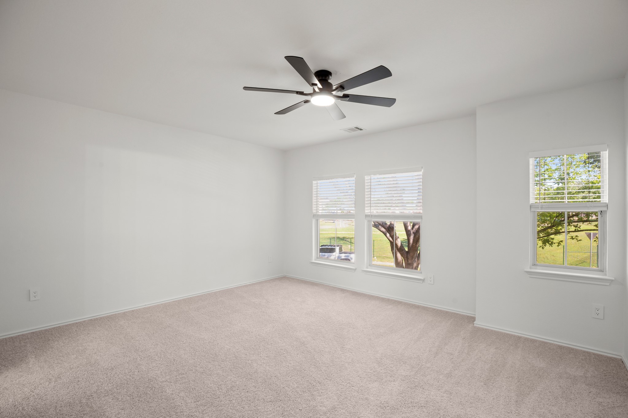 360 Sampson Kyle, TX 78640 - Photo 11 of 36 Spacious room featuring neutral carpeting and white walls