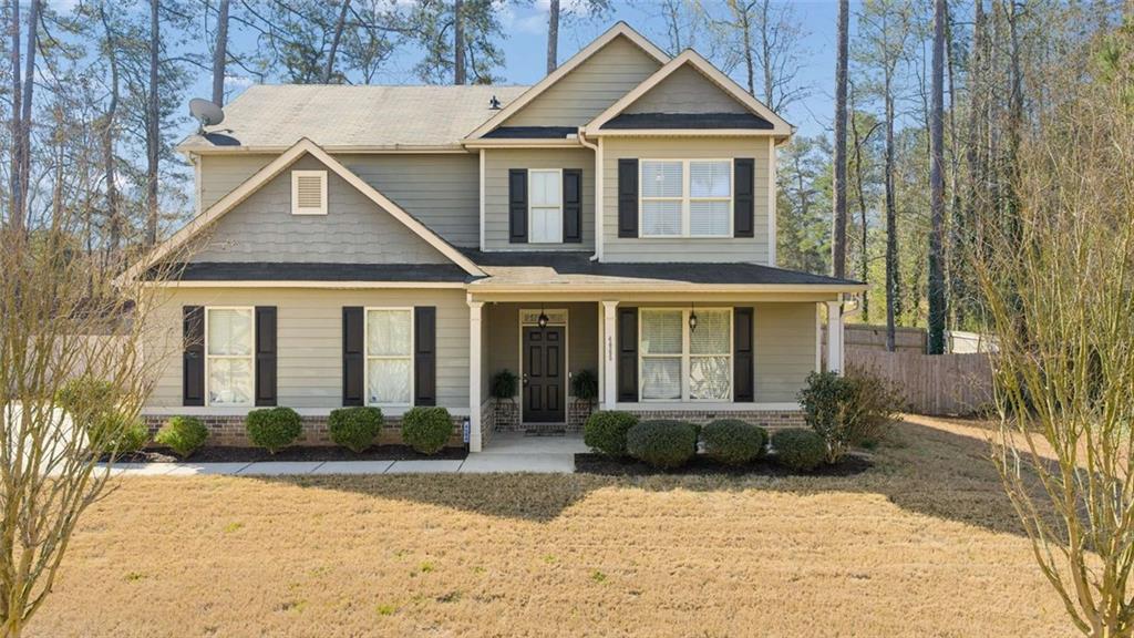 4065 McClendon Way Rex, GA 30273 - Photo 2 of 16 a front view of a house with a yard
