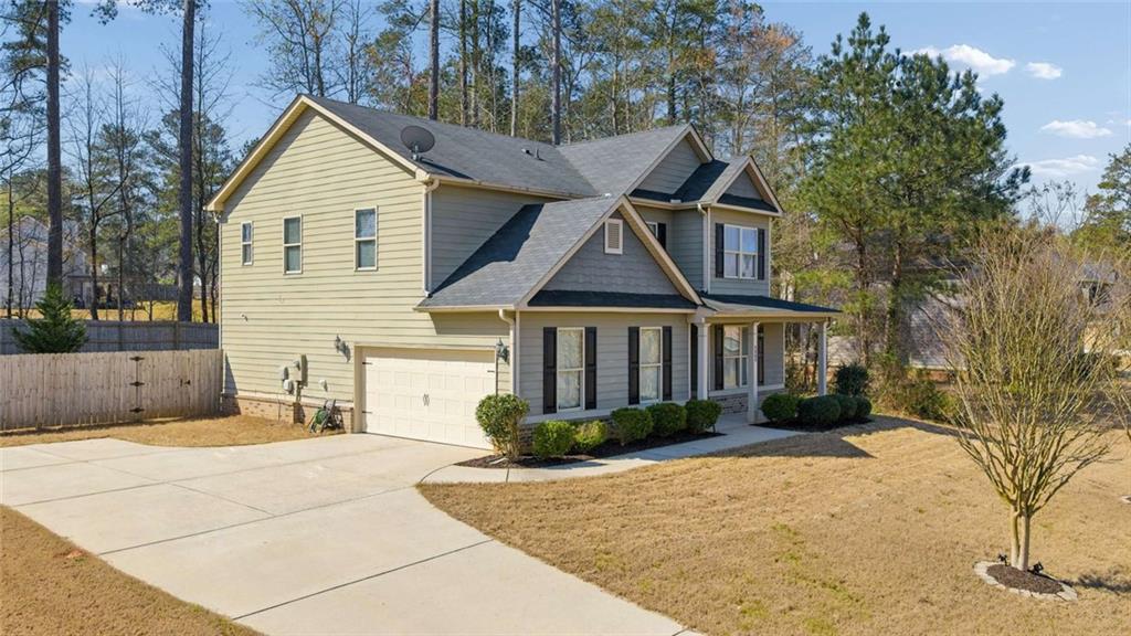 4065 McClendon Way Rex, GA 30273 - Photo 4 of 16 a front view of a house with garden