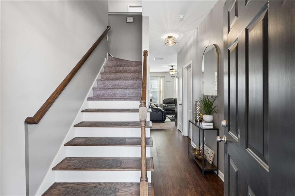 4065 McClendon Way Rex, GA 30273 - Photo 6 of 16 a view of entryway and hall with wooden floor
