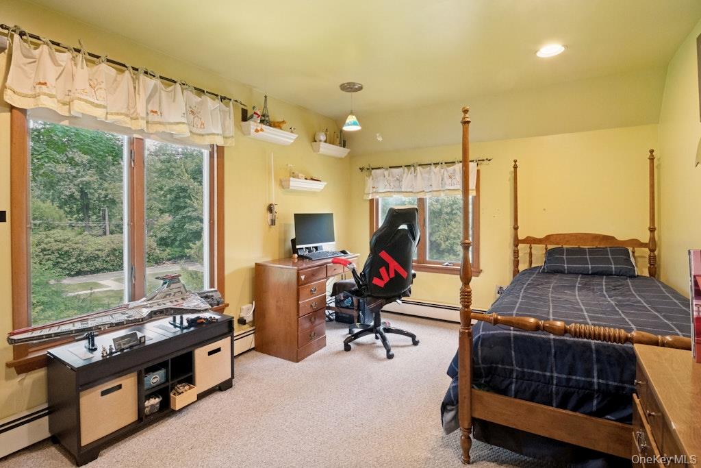 312 Quaker Road Chappaqua, NY 10514 - Photo 27 of 36 a room with gym equipment and a large window