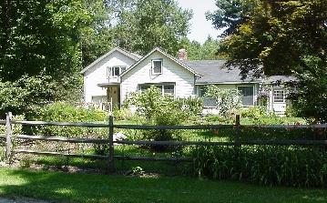 140 Rossiter Road Richmond, MA 01254 - Photo 1 of 2 a front view of a house with a yard and trees