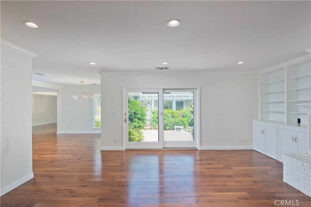 4722 Forman Lane Toluca Lake, CA 91602 - Photo 20 of 52 a view of an empty room with wooden floor and a window