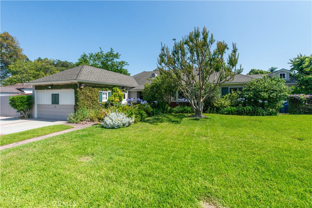 4722 Forman Lane Toluca Lake, CA 91602 - Photo 2 of 52 a front view of a house with garden
