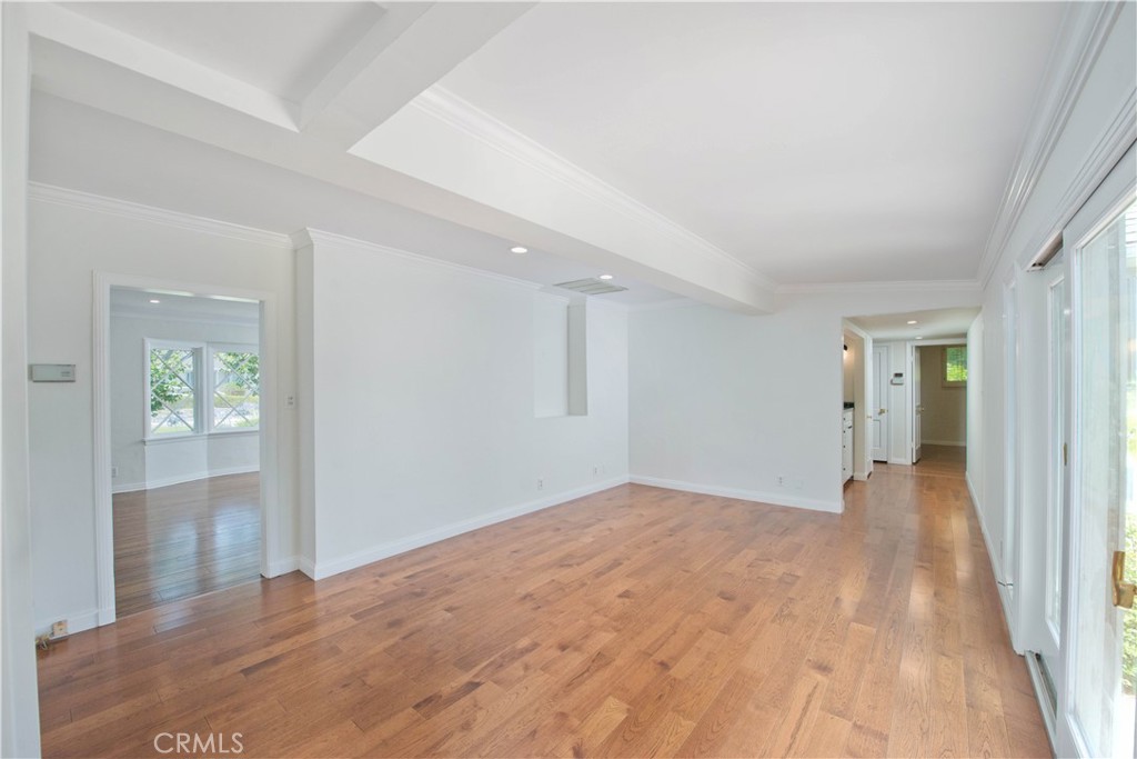 4722 Forman Lane Toluca Lake, CA 91602 - Photo 22 of 52 a view of a big room with wooden floor and windows