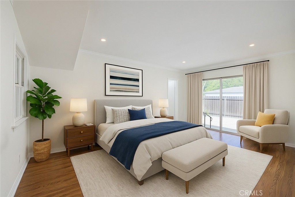 4722 Forman Lane Toluca Lake, CA 91602 - Photo 23 of 52 a bedroom with a large bed and a couch