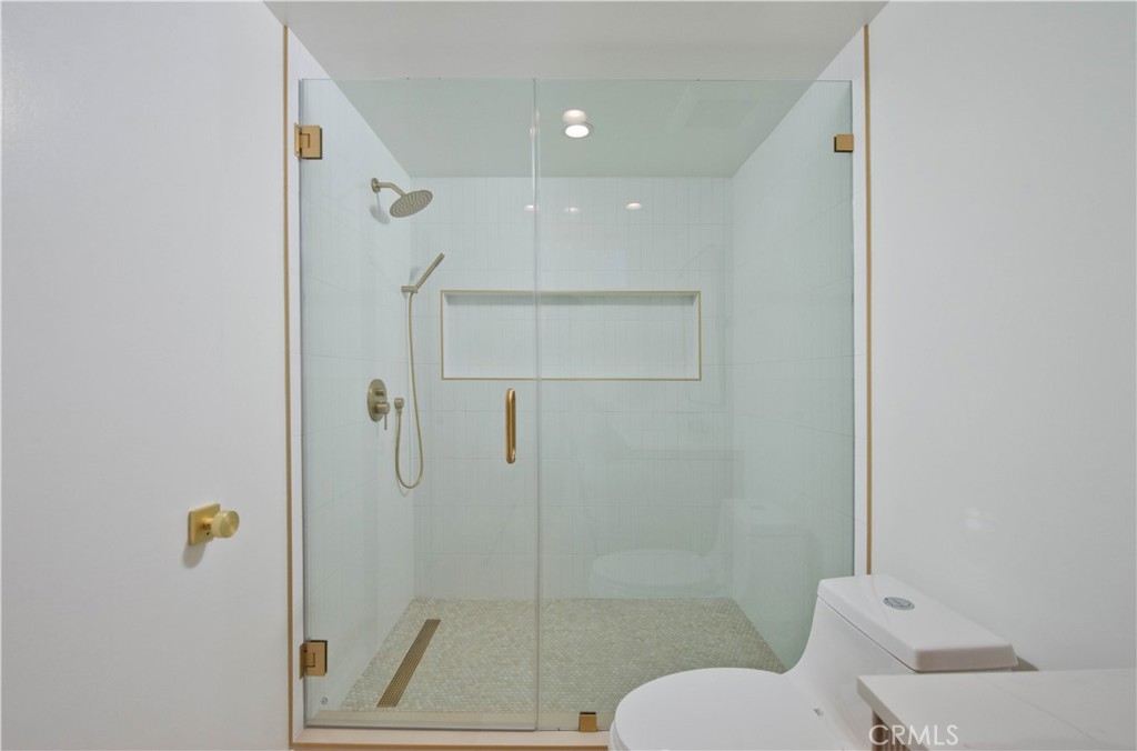 4722 Forman Lane Toluca Lake, CA 91602 - Photo 26 of 52 a bathroom with a shower and toilet